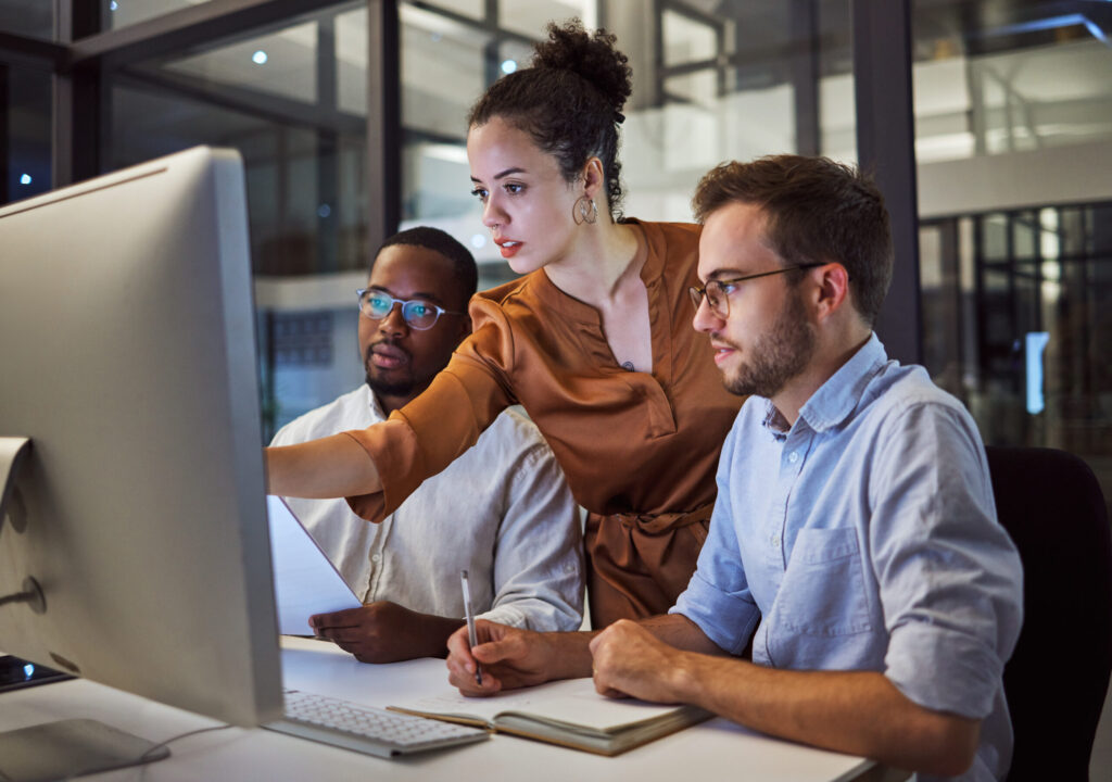 Learning, computer and training business interns in night office with manager, boss and leadership help. Men with technology planning ideas, kpi strategy and marketing innovation vision with mentor Choosing the right migration approach