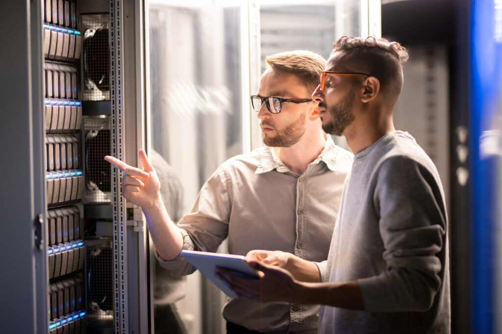 Team of specialists managing network server Why organizations move to the cloud